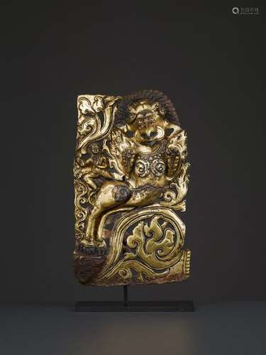 A GILT REPOUSSE RELIEF OF A SHARABA