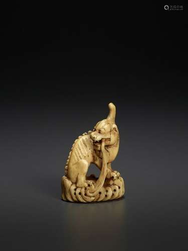 AN IVORY FIGURE OF A QILIN EARLY QING