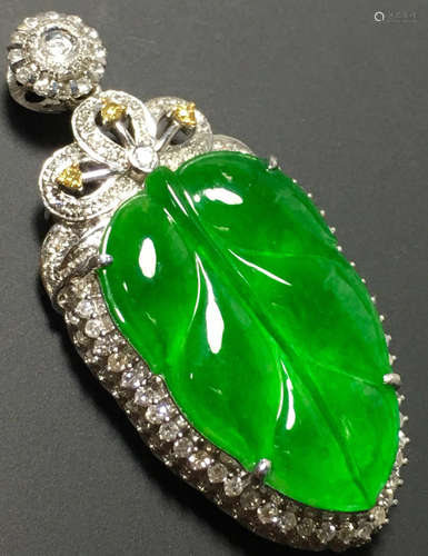 A GREEN JADEITE CARVED LEAF PENDANT, TYPE A