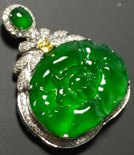 A GREEN JADEITE CARVED PEONY PENDANT, TYPE A