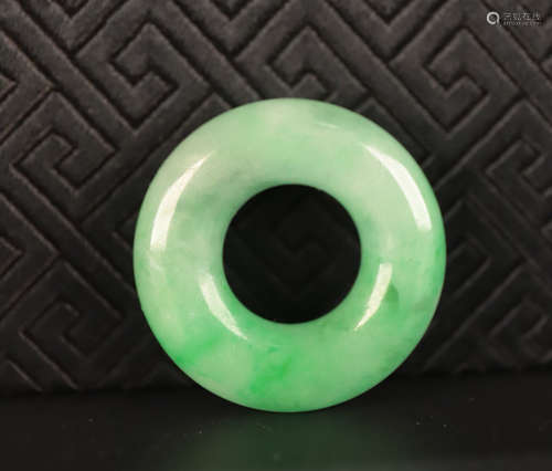 A JADEITE CARVED CIRCLE PENDANT