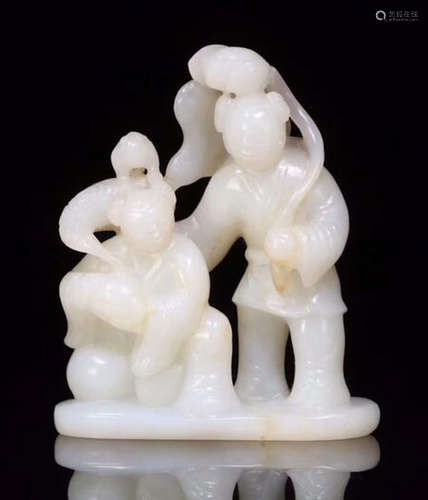 A HETIAN JADE CARVED CHILD SHAPED PENDANT