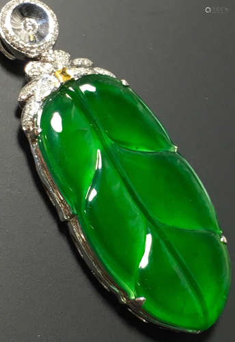 A GREEN JADEITE CARVED LEAF PENDANT, TYPE A