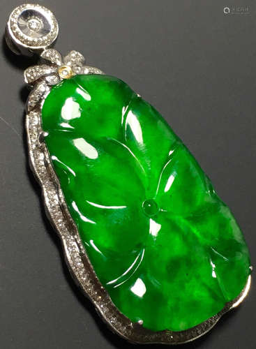 A GREEN JADEITE CARVED LEAF PENDANT, TYPE A