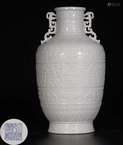 A WHITE GLAZE EMBOSS AUSPICIOUS PATTERN VASE