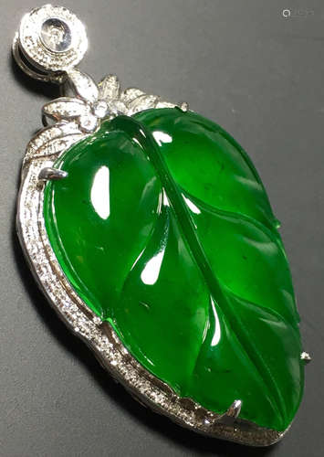 A GREEN JADEITE CARVED LEAF PENDANT, TYPE A