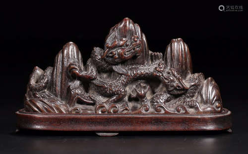 A CHENXIANG WOOD CARVED MOUNTAIN SHAPED PENDANT