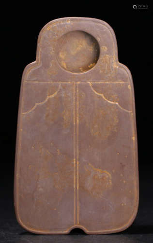 A STONE CARVED COIN SHAPED INK SLAB