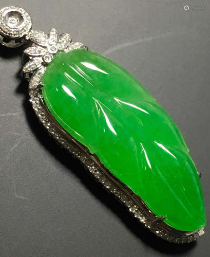 A GREEN JADEITE CARVED LEAF PENDANT, TYPE A