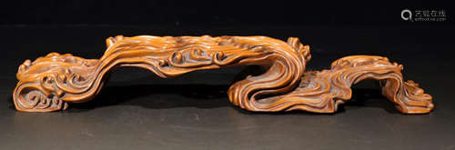 A HUANGYANG WOOD CARVED WAVE PATTERN BASE