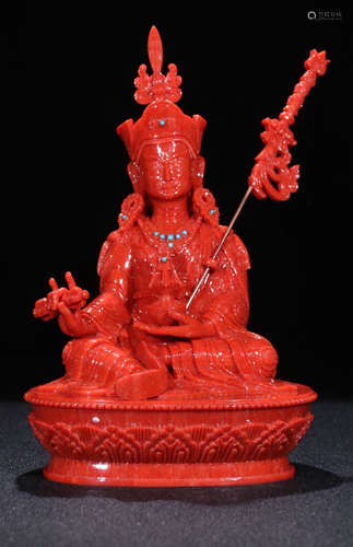 A RED CORAL CARVED LOTUS BUDDHA