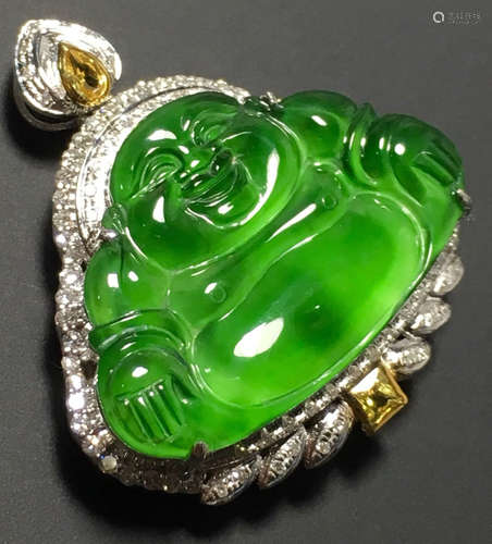 A GREEN JADEITE CARVED BUDDHA PENDANT, TYPE A