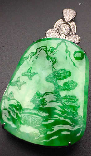 A GREEN JADEITE CARVED LANDSCAPE PATTERN PENDANT