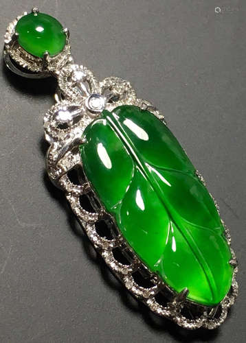 A GREEN JADEITE CARVED LEAF PENDANT, TYPE A