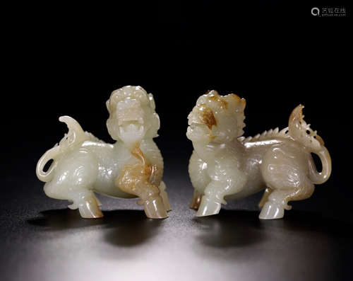 A PAIR OF HETIAN JADE KIRIN ORNAMENTS