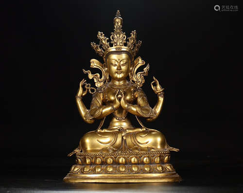 A FOUR ARMS GILTED BRONZE BUDDHA FIGURE