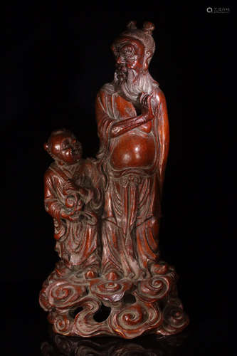 A BAMBOO FIGURE ORNAMENT DEPICTING AN OLD MAN AND A CHILD