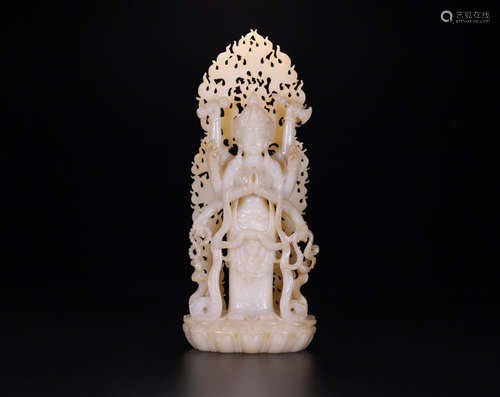 A HETIAN JADE FIGURE OF TEN-ARMS GUANYIN