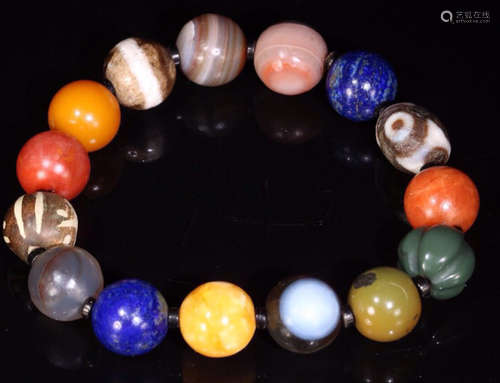 A COLORFUL BRACELET MADE OF MULTIPLE GEMS