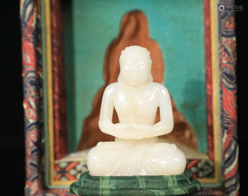 A HETIAN JADE BUDDHA FIGURE