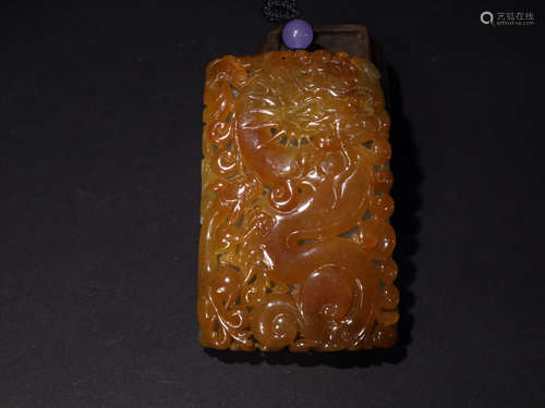 A REDISH JADEITE TABLET WITH DRAGON PATTERNS