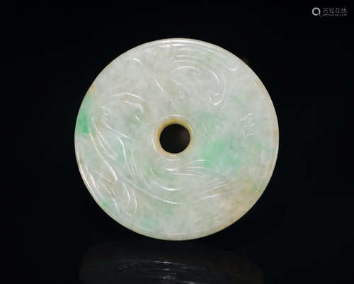 A CIRCULAR JADEITE ORNAMENT WITH DRAGON PATTERNS