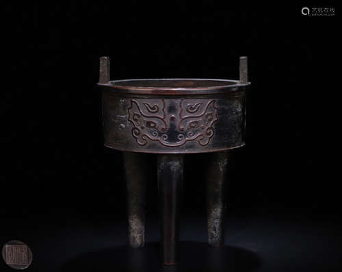 A BRONZE TRISKELION CENSER OF BEAST CARVING