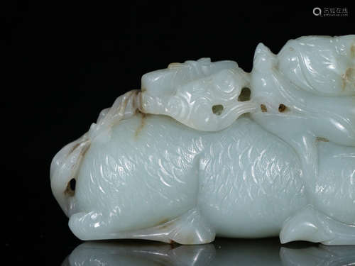 A HETIAN JADE ORNAMENT OF KIRIN