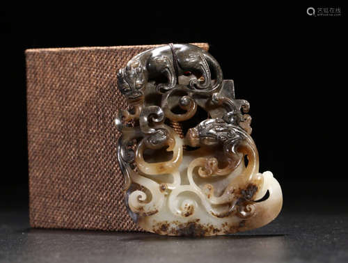 A HETIAN JADE PENDANT CARVED DRAGON PATTERN