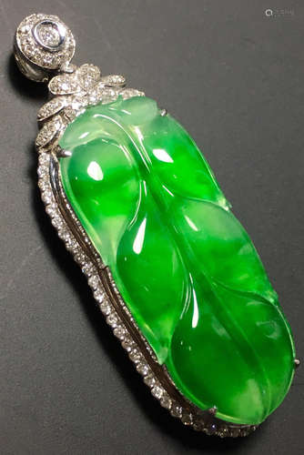 A GREEN JADEITE CARVED LEAF PENDANT, TYPE A