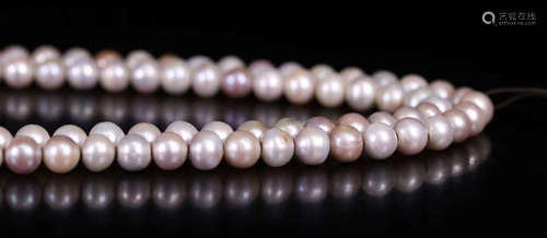 AN OLD PEARL STRING NECKLACE