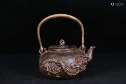 A IRON CASTED DRAGON PATTERN POT