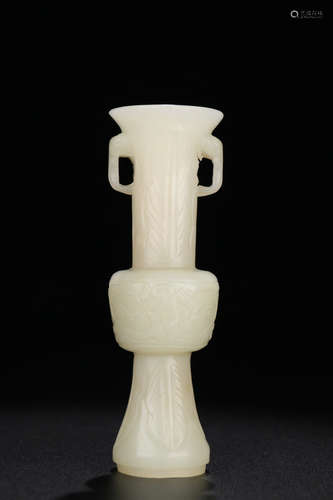 A HETIAN JADE CARVED BEAST PATTERN GU VASE