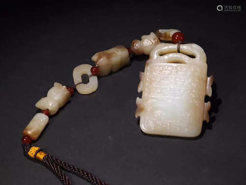 A HETIAN JADE CARVED AUSPICIOUS PATTERN PENDANT