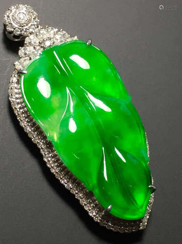 A GREEN JADEITE CARVED LEAF PENDANT, TYPE A