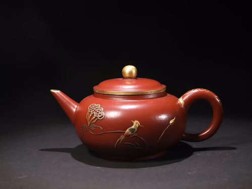 A ZISHA CARVED BIRD PATTERN TEA POT