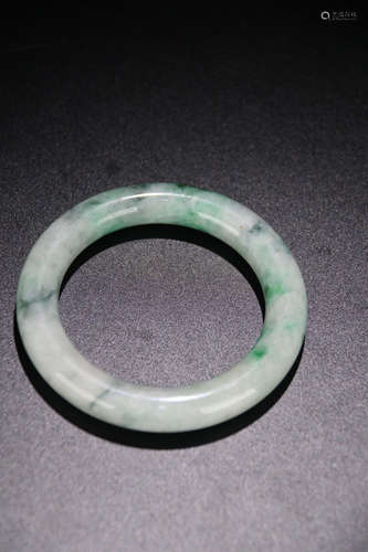 A JADEITE CARVED SIMPLE BANGLE