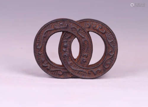 A CHENXIANG WOOD DOUBLE RING PATTERN PENDANT