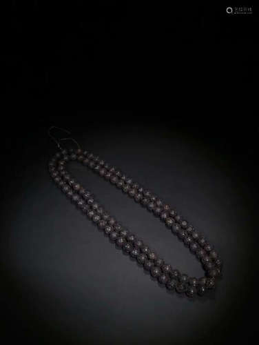 A CHENXIANG WOOD CARVED BEADS STRING NECKLACE