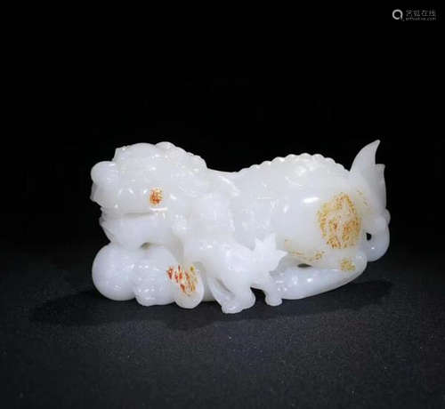 A HETIAN SUET JADE CARVED LION SHAPED PENDANT