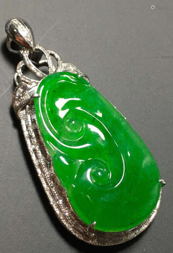 A GREEN JADEITE CARVED AUSPICIOUS PENDANT, TYPE A