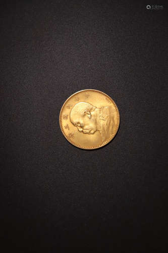 A GOLD CASTED FIGURE HEAD PATTERN COIN