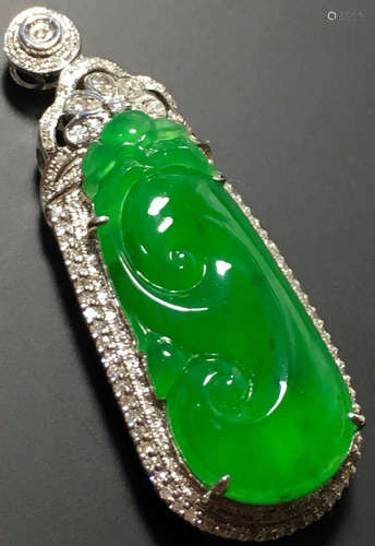 A GREEN JADEITE CARVED AUSPICIOUS PENDANT, TYPE A