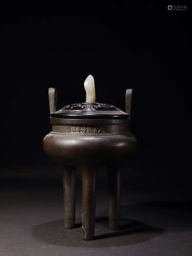 AN OLD DOUBLE-EAR BRONZE TRIPOD CENSER