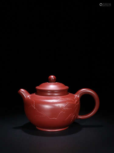 AN OLD YIXING PURPLE CLAY TEAPOT