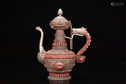 AN OLD TIBETAN SILVER WINE POT