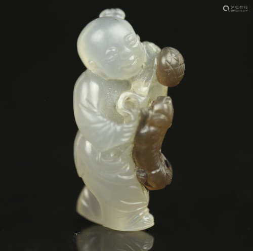 A Chinese Carved Agate Figure of a Little Boy