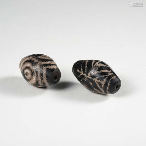 TWO CHINESE DZI BEADS TANG DYNASTY