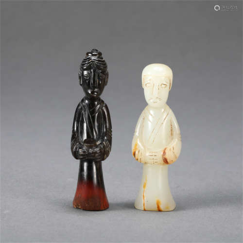 TWO CHINESE WHITE AND INK JADE STANDING FIGURES