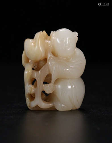 A HETIAN JADE CARVED CHILD SHAPED PENDANT